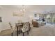 Living room features comfortable seating and access to a balcony at 4260 Placida Rd # 24B, Englewood, FL 34224
