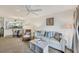 Living area with sofa, coffee table, and view of kitchen at 4260 Placida Rd # 24B, Englewood, FL 34224