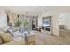 Living room with sofa, carpet, and access to a balcony at 4260 Placida Rd # 24B, Englewood, FL 34224