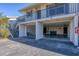 Condo building with parking under the building and additional parking in front at 4260 Placida Rd # 24B, Englewood, FL 34224