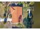 Aerial view showcasing home's tile roof and waterfront lot at 4696 Pompano St, Placida, FL 33946