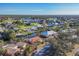 Aerial view of canal front home in a peaceful neighborhood at 4696 Pompano St, Placida, FL 33946