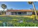 Home exterior showcasing a large screened porch at 4696 Pompano St, Placida, FL 33946