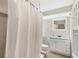 Clean bathroom with white vanity, shower/tub combo, and tile floor at 4696 Pompano St, Placida, FL 33946