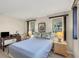 Bedroom with blue bedding, work desk, and two windows at 4696 Pompano St, Placida, FL 33946
