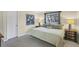 Spacious bedroom with king-size bed, nightstands, and large window at 4696 Pompano St, Placida, FL 33946
