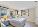 Bedroom with striped bedding, two nightstands, and two windows at 4696 Pompano St, Placida, FL 33946