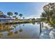 Scenic view of canal with neighboring houses at 4696 Pompano St, Placida, FL 33946