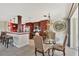 Bright dining area with glass table and chairs near kitchen and living areas at 4696 Pompano St, Placida, FL 33946
