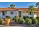 Front view of charming home with terracotta roof and landscaping at 4696 Pompano St, Placida, FL 33946
