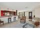 Open kitchen with breakfast bar and dark wood cabinets at 4696 Pompano St, Placida, FL 33946