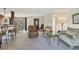 Bright living room with tile floors, comfortable seating, and views to dining area at 4696 Pompano St, Placida, FL 33946