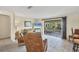 Living room with comfortable seating and access to a screened porch at 4696 Pompano St, Placida, FL 33946