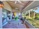 Spacious screened porch with seating area and water view at 4696 Pompano St, Placida, FL 33946