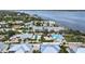 Gorgeous aerial view of waterfront homes featuring pools, docks, and lush tropical landscaping at 5031 N Beach Rd # 116, Englewood, FL 34223