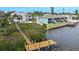 Aerial view showing property, dock, and waterfront access at 5031 N Beach Rd # 116, Englewood, FL 34223