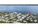 Stunning aerial view captures the essence of waterfront living amidst lush greenery and serene waters at 5031 N Beach Rd # 116, Englewood, FL 34223