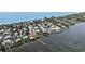 Breathtaking aerial view showcasing waterfront homes with docks at 5031 N Beach Rd # 116, Englewood, FL 34223
