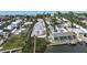 Beautiful waterfront homes with docks and beach access are seen in this sunny aerial view at 5031 N Beach Rd # 116, Englewood, FL 34223