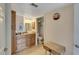 Bathroom features a modern bowl sink, granite counters and wood cabinets at 5031 N Beach Rd # 116, Englewood, FL 34223