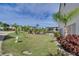 Landscaped grounds showcasing a tropical oasis with a pool at 5031 N Beach Rd # 116, Englewood, FL 34223