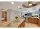 Spacious kitchen with island opens to living area and features modern appliances at 5031 N Beach Rd # 116, Englewood, FL 34223