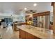 Gourmet kitchen featuring a large island, stainless appliances, and open to living area at 5031 N Beach Rd # 116, Englewood, FL 34223