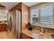 Kitchen featuring stainless steel refrigerator and granite countertops at 5031 N Beach Rd # 116, Englewood, FL 34223