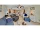 Cozy living room boasts tile floors, comfortable seating and ceiling fan at 5031 N Beach Rd # 116, Englewood, FL 34223