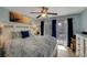 Spacious bedroom with king-size bed and private balcony access at 5031 N Beach Rd # 116, Englewood, FL 34223