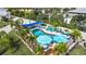 Aerial view of the refreshing pool with lounge seating, shade and landscaping at 5031 N Beach Rd # 116, Englewood, FL 34223