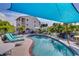 Inviting outdoor pool with ample seating and shade, ideal for enjoying warm weather at 5031 N Beach Rd # 116, Englewood, FL 34223