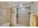 Shower with tile surround and coordinated shower curtain at 5031 N Beach Rd # 116, Englewood, FL 34223