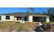 New construction home with block exterior and shingle roof. Under construction at 5306 Jennings Blvd, Port Charlotte, FL 33981