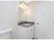 Simple bathroom with white vanity and grey countertop at 5353 Kaspar St, Port Charlotte, FL 33981