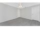 Spacious bedroom with grey tile floors and closet at 5353 Kaspar St, Port Charlotte, FL 33981