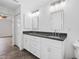 Double vanity bathroom with granite countertop and modern lighting at 5400 Jennings Blvd, Port Charlotte, FL 33981