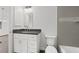Bathroom with white cabinets, granite countertop, and bathtub at 5400 Jennings Blvd, Port Charlotte, FL 33981
