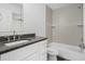 Clean bathroom with white cabinets, granite countertop, and shower/tub combo at 5400 Jennings Blvd, Port Charlotte, FL 33981
