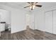 Bright bedroom with ceiling fan and en-suite bathroom at 5400 Jennings Blvd, Port Charlotte, FL 33981