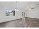 Bright dining room with tile flooring, chandelier, and access to backyard at 5400 Jennings Blvd, Port Charlotte, FL 33981