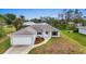 Newly constructed home with a two-car garage and landscaped front yard at 5400 Jennings Blvd, Port Charlotte, FL 33981