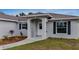 House entrance with walkway and landscaping at 5400 Jennings Blvd, Port Charlotte, FL 33981