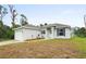 Charming one-story home with attached garage and manicured lawn at 5400 Jennings Blvd, Port Charlotte, FL 33981