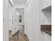Clean hallway with access to bedrooms and other rooms at 5400 Jennings Blvd, Port Charlotte, FL 33981