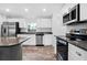 Bright kitchen, featuring stainless steel appliances and granite countertops at 5400 Jennings Blvd, Port Charlotte, FL 33981