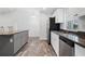 Open kitchen with granite countertops and stainless steel appliances at 5400 Jennings Blvd, Port Charlotte, FL 33981
