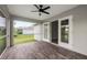 Bright screened porch features tile floors, ceiling fan and access to interior at 5400 Jennings Blvd, Port Charlotte, FL 33981
