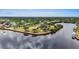 An aerial view of a waterfront park with benches and trees at 5400 Jennings Blvd, Port Charlotte, FL 33981