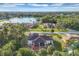 Aerial view showcasing the home's location near a lake at 6256 Pennell St, Englewood, FL 34224